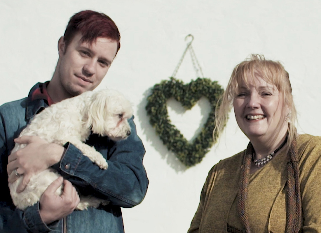 Wendy and Daniel holding a dog
